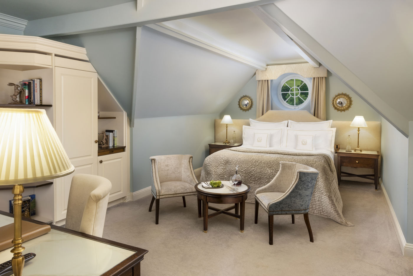 A Cosy Room at Grantley Hall, with a handcrafted bed under the eaves